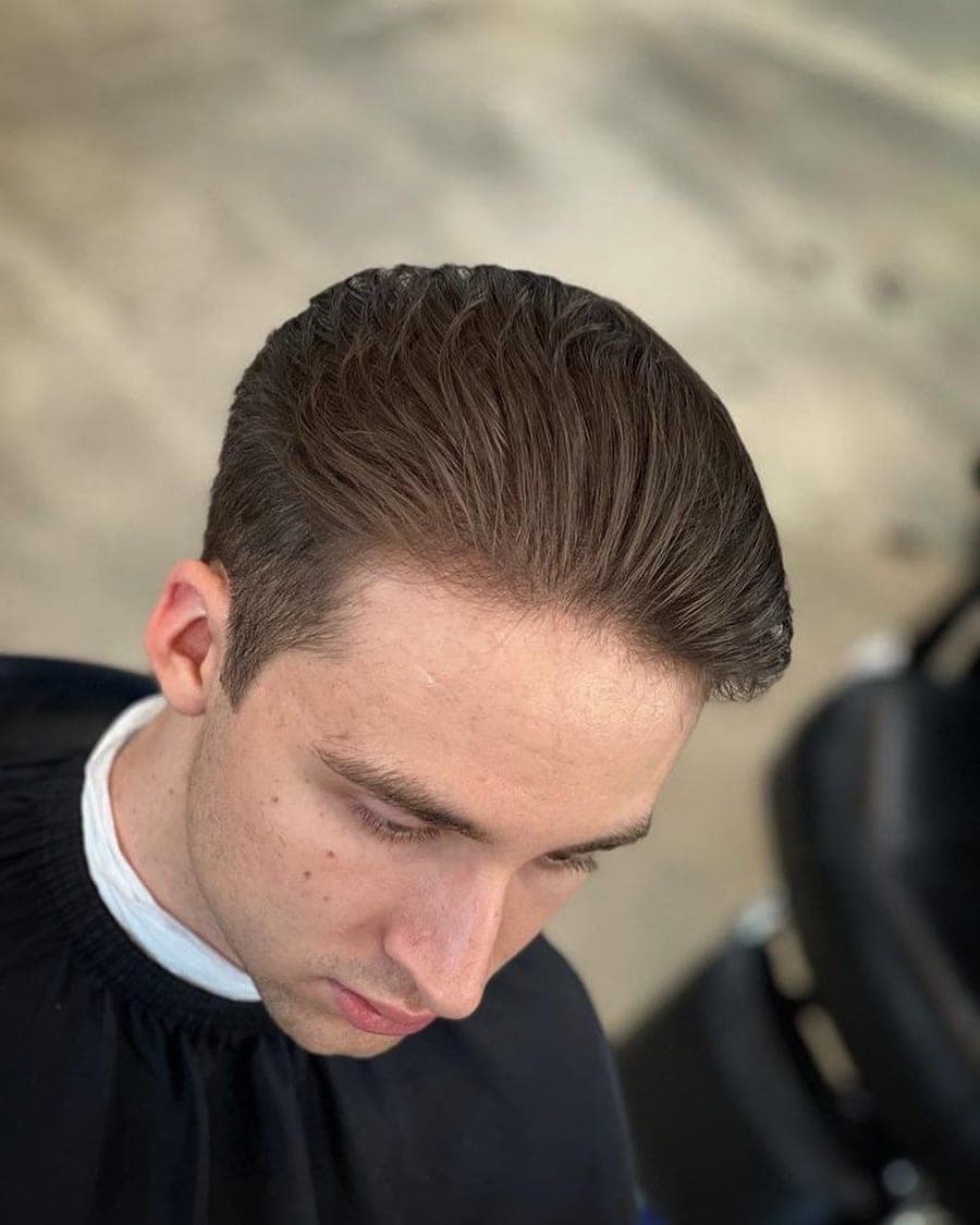 Slicked-back cut with a side part, seen from above